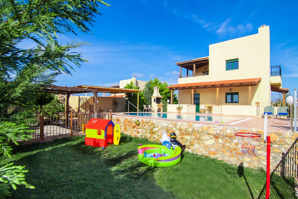 Outdoor area - swimming pool and fenced playground for children