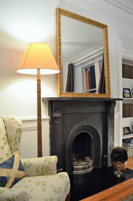 Nice reading chair next to fireplace in Living Room
