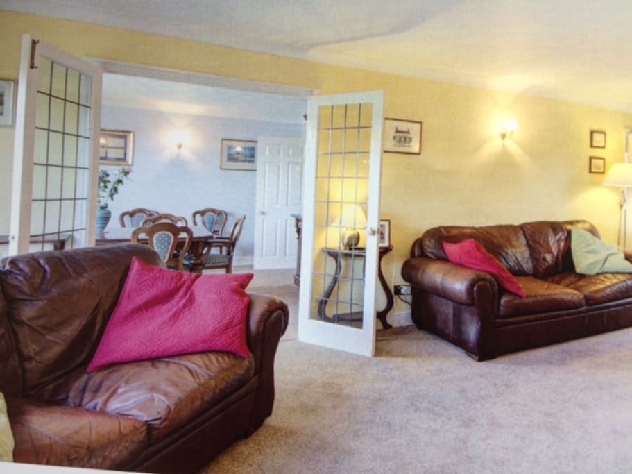 Large Living room opens onto large dining room (8 main chairs plus others) table can be extended further. Gas fire. Central heating throughout (not garden 5th bedroom which has an electric fire)