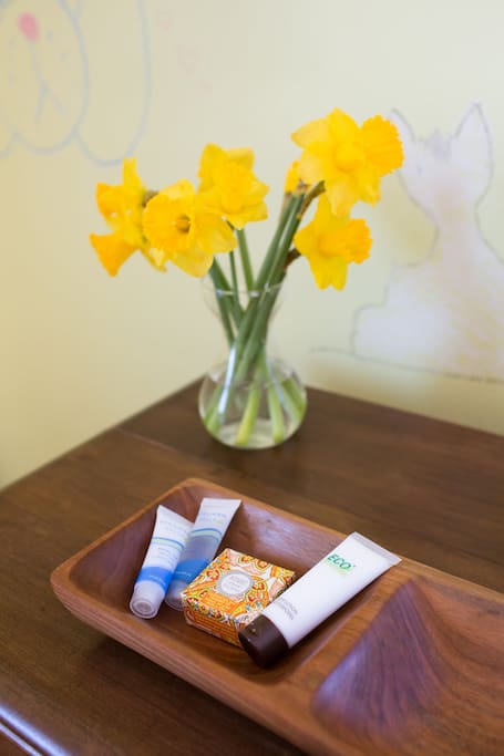 On your dresser, you'll find fresh flowers and complimentary eco-friendly soap, shampoo, conditioner, and lotion.