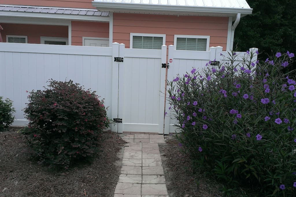 Private back entrance secured and pavers sidewalk.