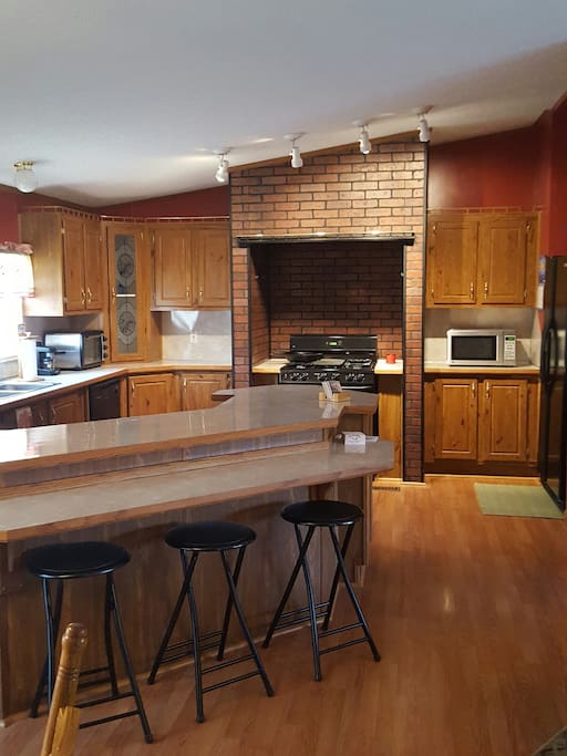Well equipped large kitchen with counter seating. Amenities include microwave,toaster oven, coffee bar, espresso machine, and press. Blender, ice maker and water in door. A second small refrigerator for drinks and freezer space.