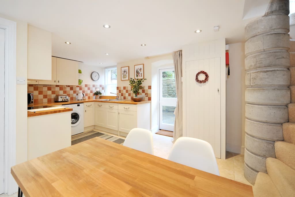Well equipped kitchen onto garden