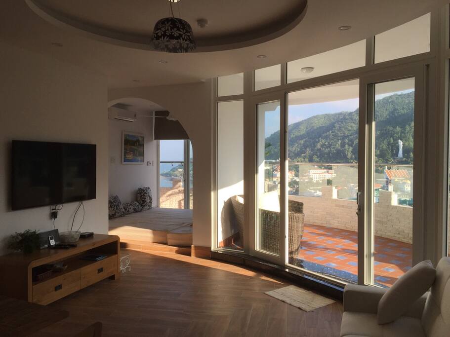 Living room and open sleeping area.