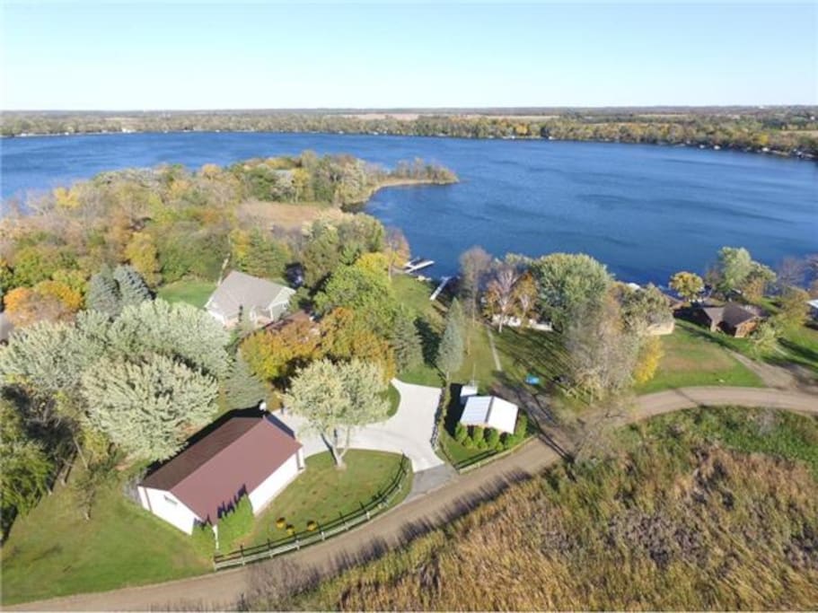 Beautiful 1 acre yard with several tree swings, apple trees and grape vines! Lots of concrete parking. Boat launch is right around the corner!