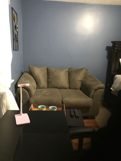 Relax on this comfortable sofa while watching tv and enjoying some yummy gourmet coffee on the host.