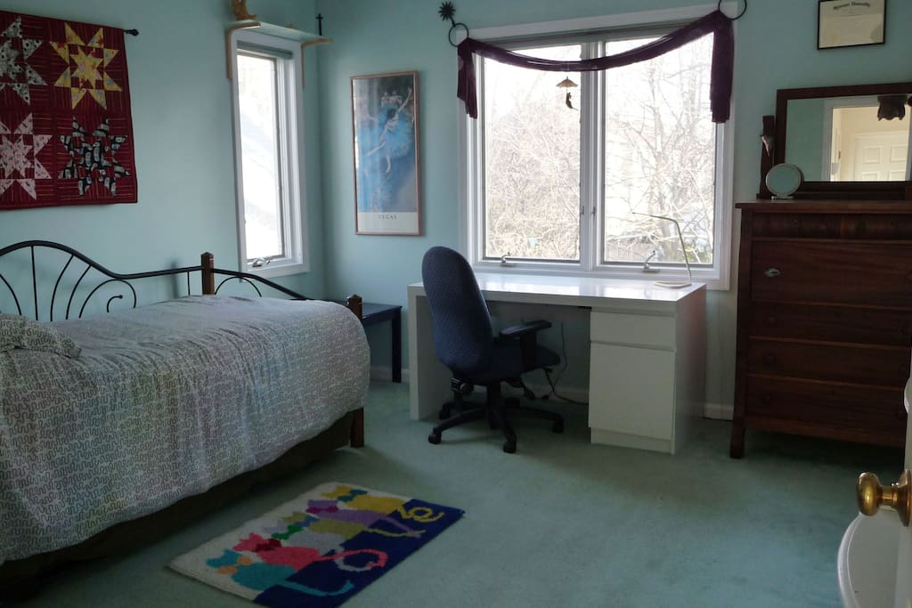 Room-1 is upstairs, with a day/trundle beds, desk, bureau, closet and view of the back garden. It is steps away from the hall bath shared with Rm-2.