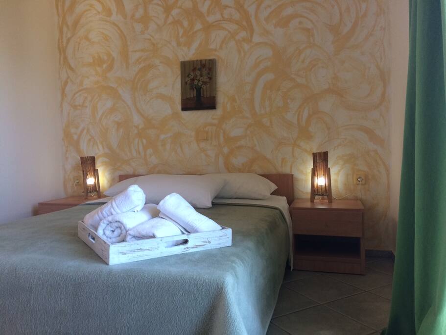 Room with a double bed and seaview