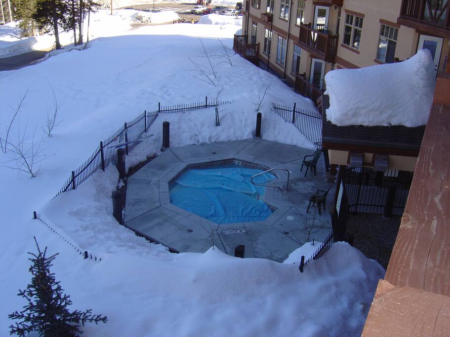 Outdoor hot tub at ground level.