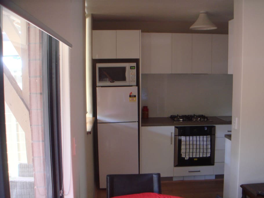 New kitchen - refrig. New gas appliances. Washing machine and dryer in laundry (to right)