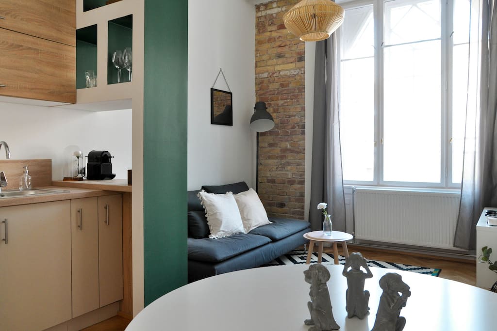 Living room, dining table and kitchen