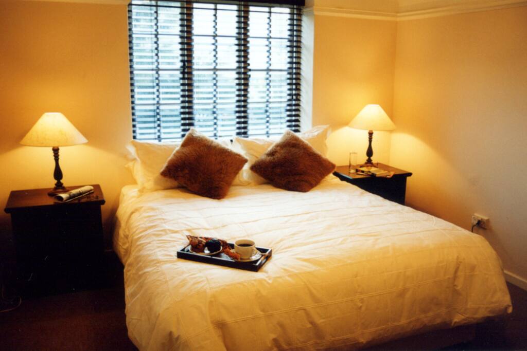 Queen beds in both rooms with built in cupboards