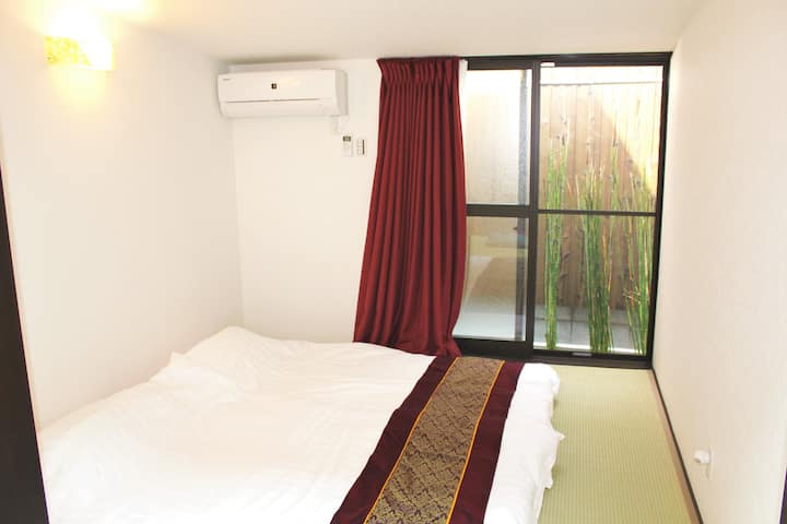 Tatami Room with Garden View.  Two Single JP Futon Beds equal to a King Size Bed can be arranged. 