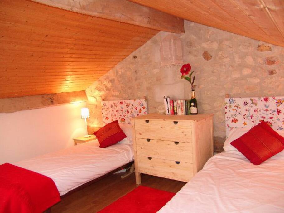 Two single beds on a mezzanine level (above living room, without a door)