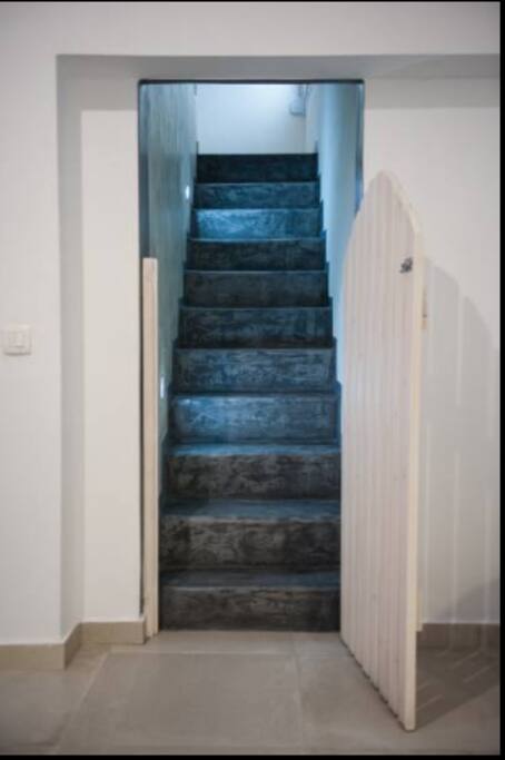 Stairs going to the upper bedroom