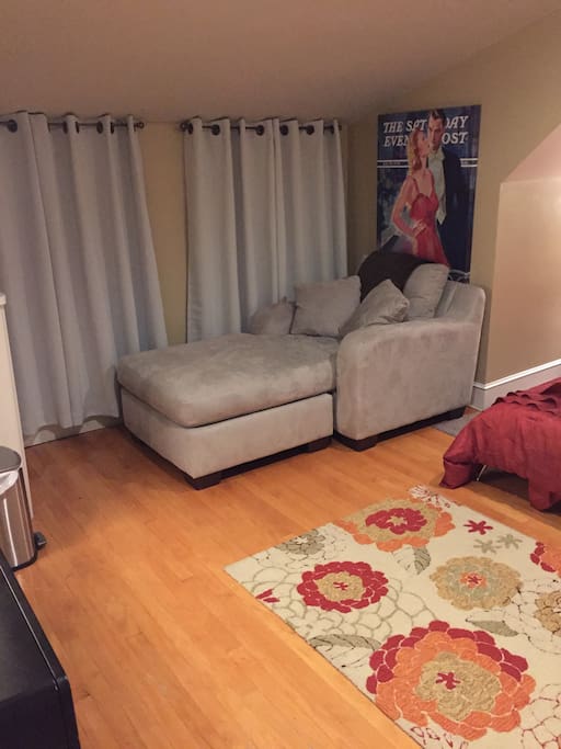 Cozy chaise that's great for reading or just relaxing after a day of sightseeing.