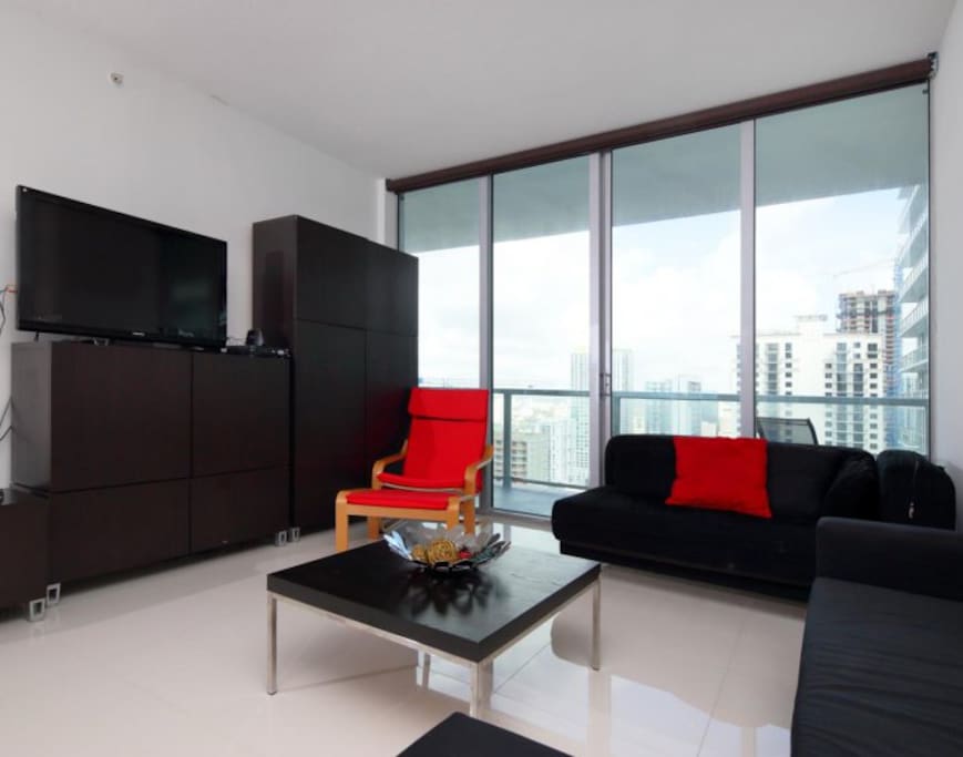 Living room with TV, DVD, Cable, internet, and music speakers