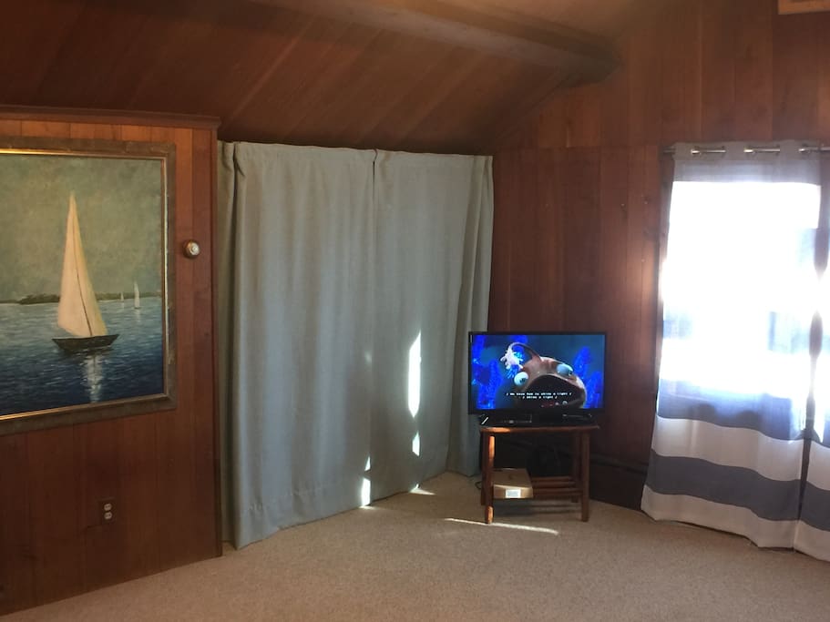 Cable TV and a curtained walk in closet