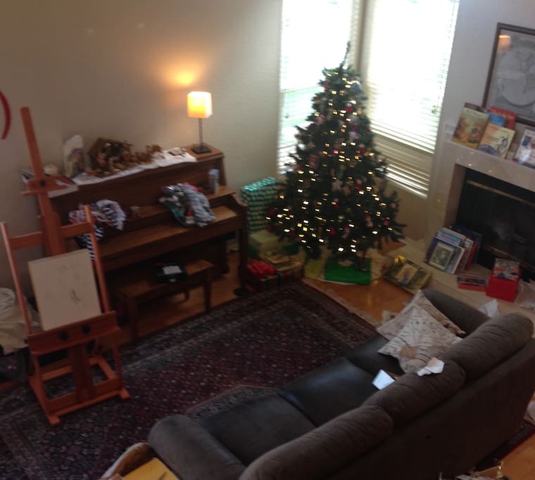 View of the spacious living room including working piano. Seen here from above outside the rental bedroom.