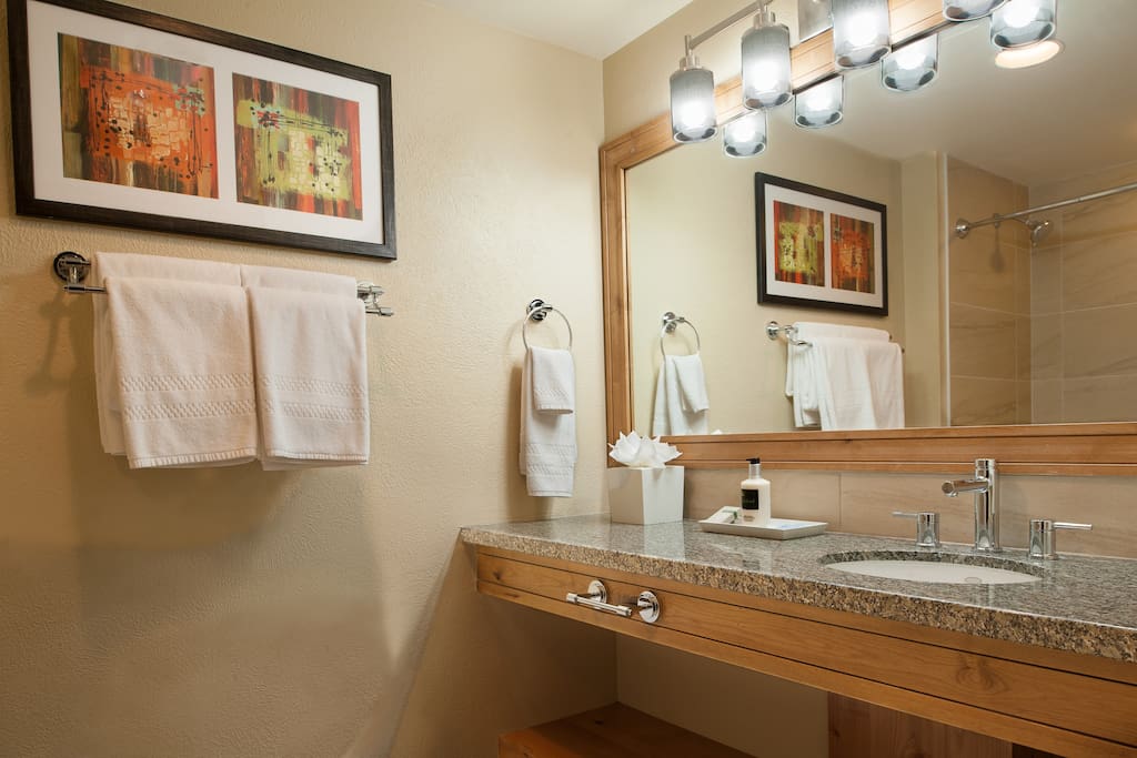 Prepare for the day ahead in the bright and modern bathroom.