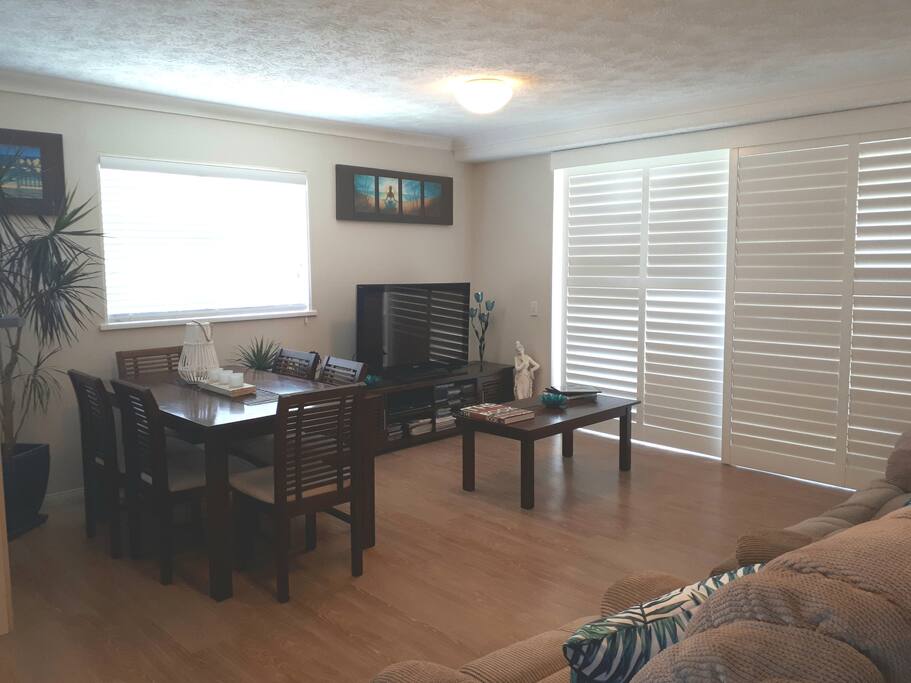 Spacious lounge and dining room with private balcony for stunning sunrises and sunsets