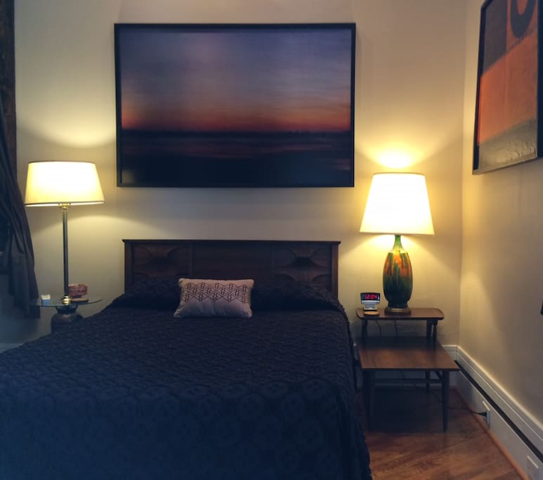 Full size tempurpedic bed on main floor of studio