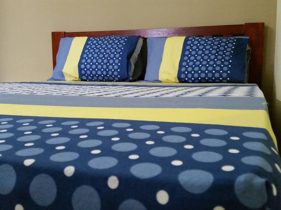 Master bedroom with a queen size bed