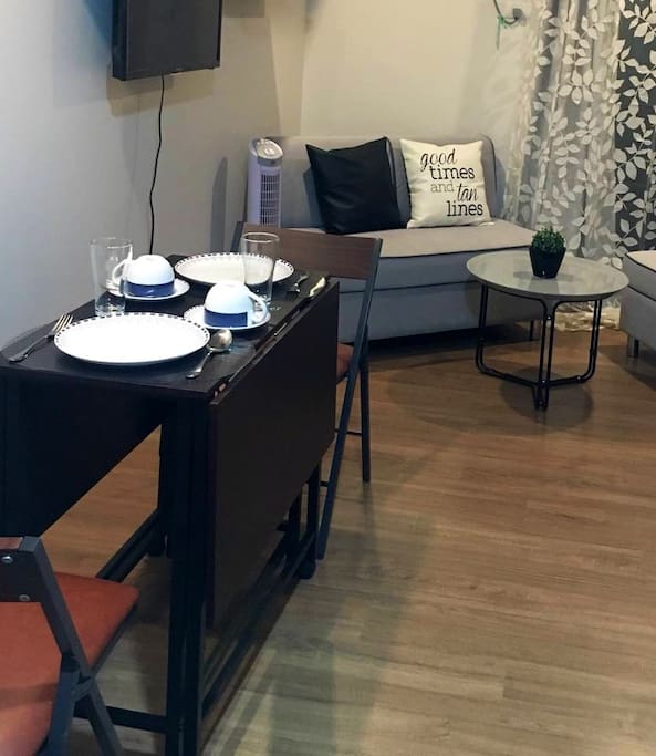 The table is expandable in case you need more space for work. There are additional chairs kept in the storage cabinet too.