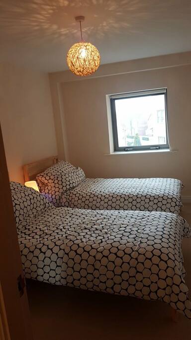 Twin bedded room with wardrobe