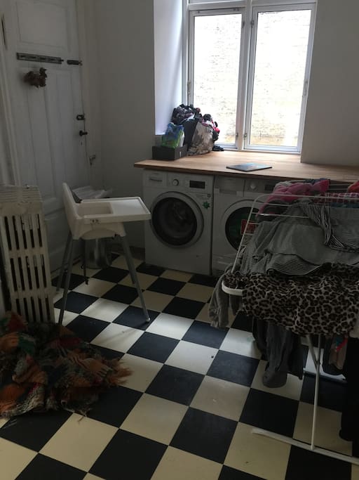 Laundry room in the flat with washing maskine and dryer