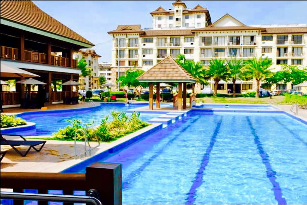 Daytime view - The low-rise building where the unit is situated in front of the amenities ( swimming pool, clubhouse, basketball court, children's playground & fitness gym )