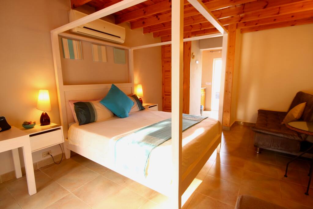 Large comfy bed (160cm wide x 2m long) with high quality mattress and bedding plus quiet air-conditioning. Sofa bed (120cm wide x 190cm). iPod docking speakers - so bring your iPod along for music.
