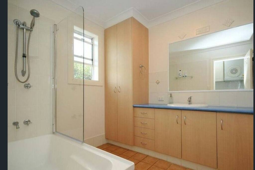 Good sized bathroom with toilet. Additional toilet located off the laundry.