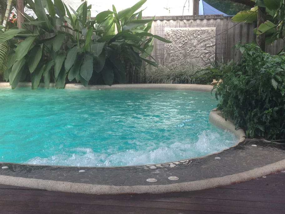 outdoor spa and bbq under bali style gazebo