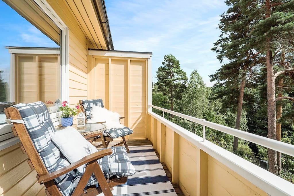 Sunny balcony with sunchairs.