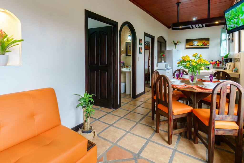 Condo 2: Living and dining area with flat screen tv.