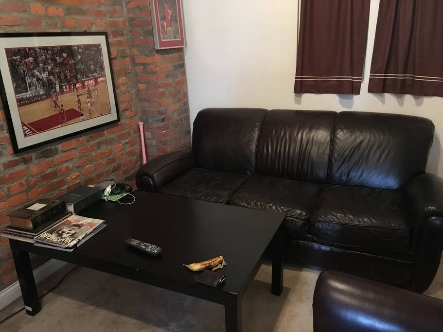 Comfortable seating in TV room, couch also eligible as a sleeping option.