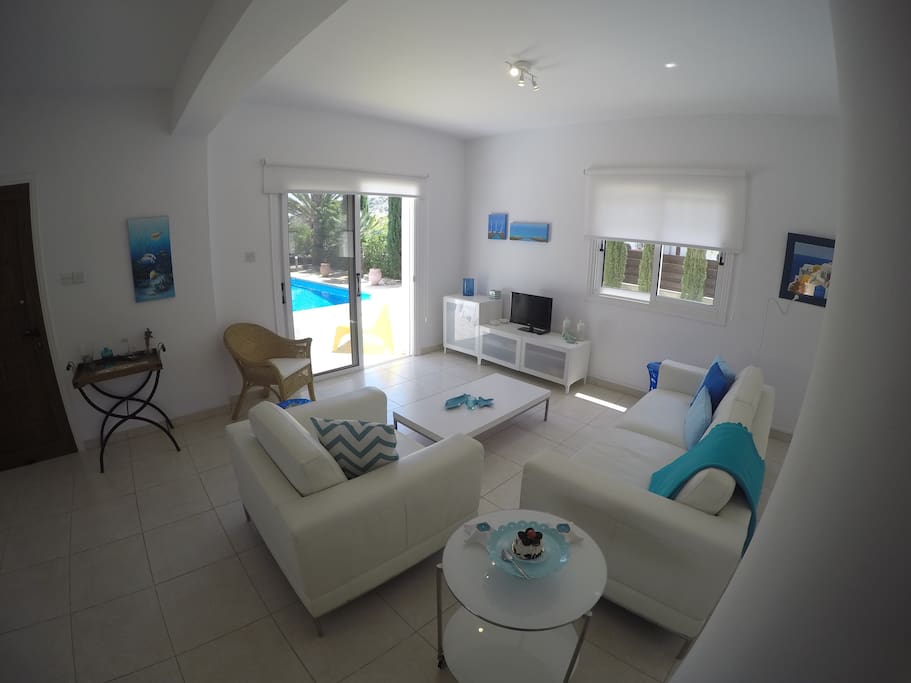 Living room area leading out to the pool