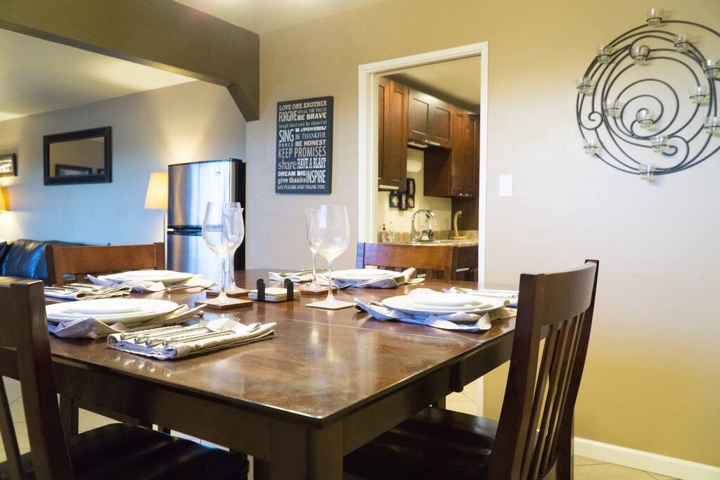 Up for a little fine dining? Pub-height dining table in the foreground, and guest-dedicated refrigerator in the background...plenty of room for your cold items. (shared-space)
