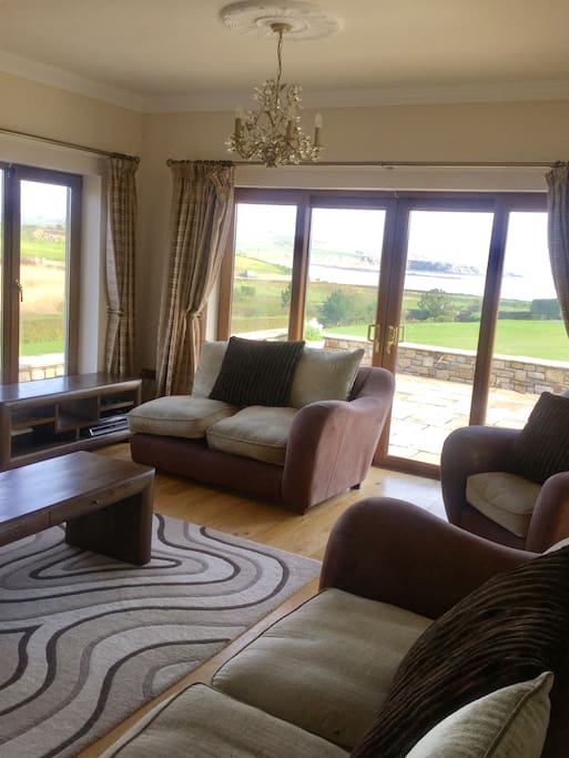 Comfortably sitting room with open fire for the winter months