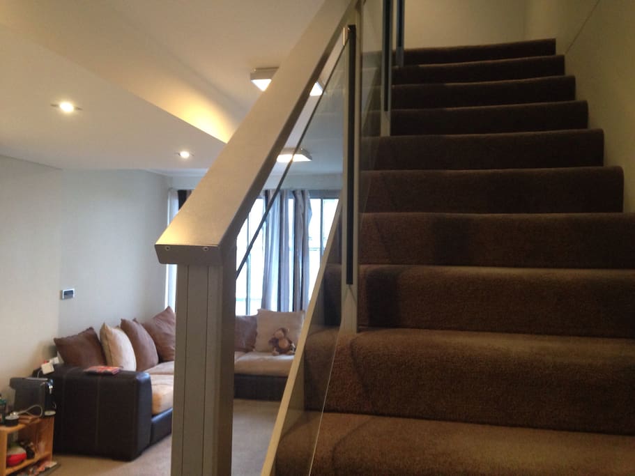 The stairs bring you upstairs to the bathroom and bedroom