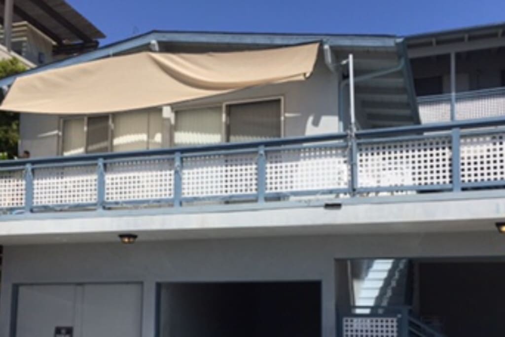View of the balcony and swing from the street