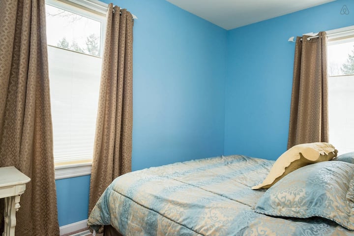 1st floor bright bedroom with king size bed.  Pull the drapes for a tranquil experience.