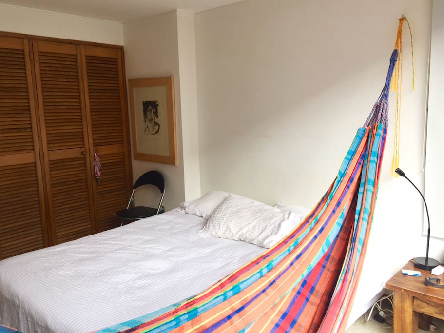 Room with double-size bed + traditional hammock