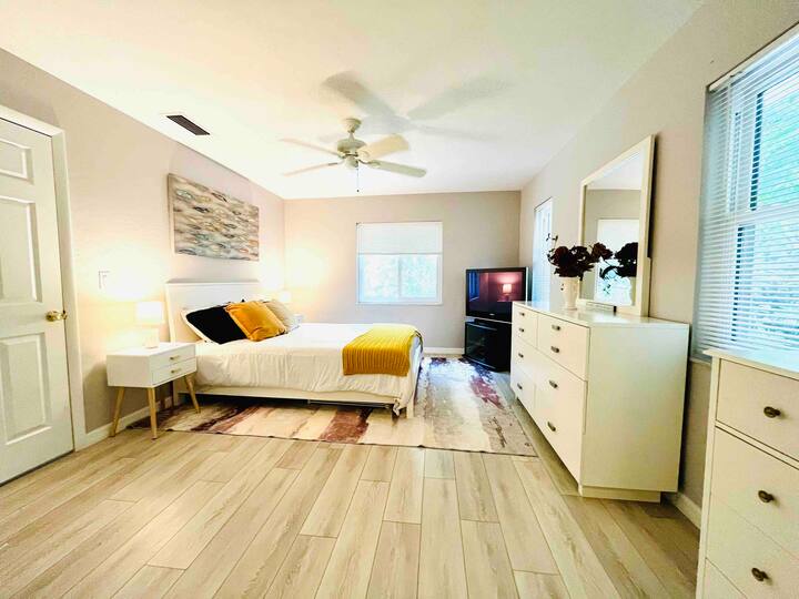 Guest bedroom: New queen bedroom set, Layla dual-sided (soft/firm) mattress, large dresser w/mirror, 2 nightstands. No TV. Wood-look tile, 3 windows w/backyard views. Adjacent to guest bath. Note: Photo is outdated. Updated pic coming in April.