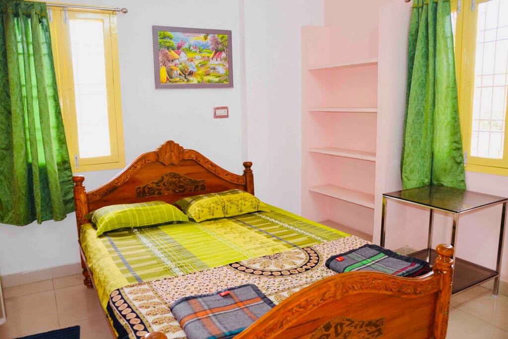 3rd bedroom consists of a Queen sized bed and a fan