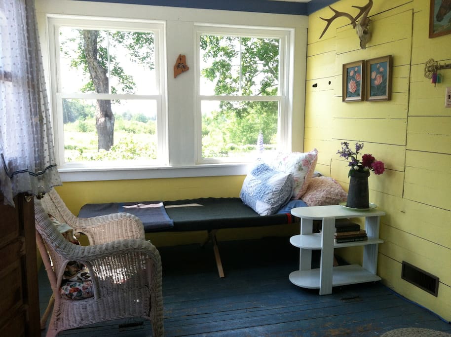 The sunroom (the old store) with summer cot