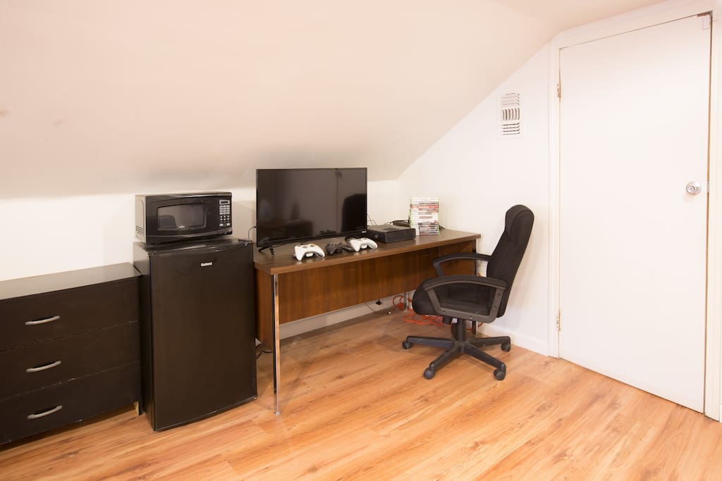 Ensuite bar fridge, microwave, TV (Amazon Prime Stick), and video games (Xbox 360)