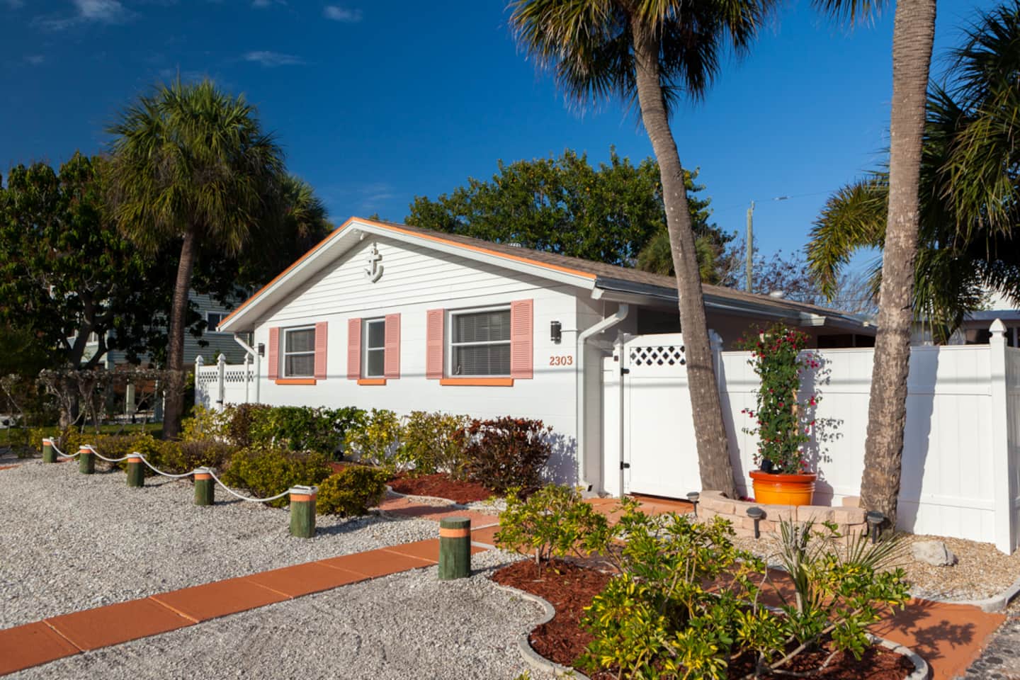 Aerial view over the Happy Turtle duplex in Bradenton Beach, bay in the distance