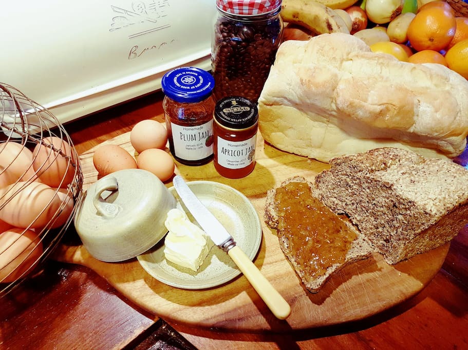 Help yourself to breakfast. :-)
Fresh eggs, homemade jams and crusty bread.